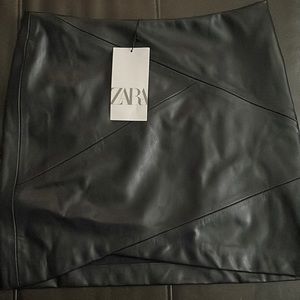 Brand new tag on black faux leather skirt size small